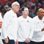 
			
				                                Syracuse head coach Jim Boeheim, left, assistant coach and Scranton native Gerry McNamara, center, and associate head coach Adrian Autry watch from the sideline during a game earlier this season. Boeheim coached his final game with the school on Wednesday, with Autry set to take over.
                                 Adrian Kraus | AP file photo

			
		